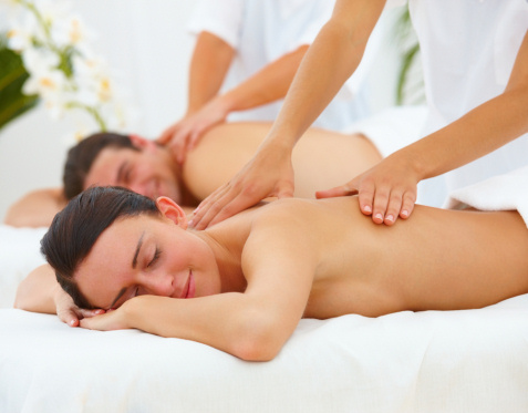 man and woman getting massage